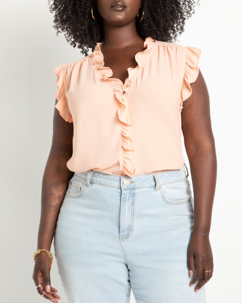 Front of a model wearing a size 14 Claire Ruffle Blouse in Dusty Pink by ELOQUII. | dia_product_style_image_id:216951